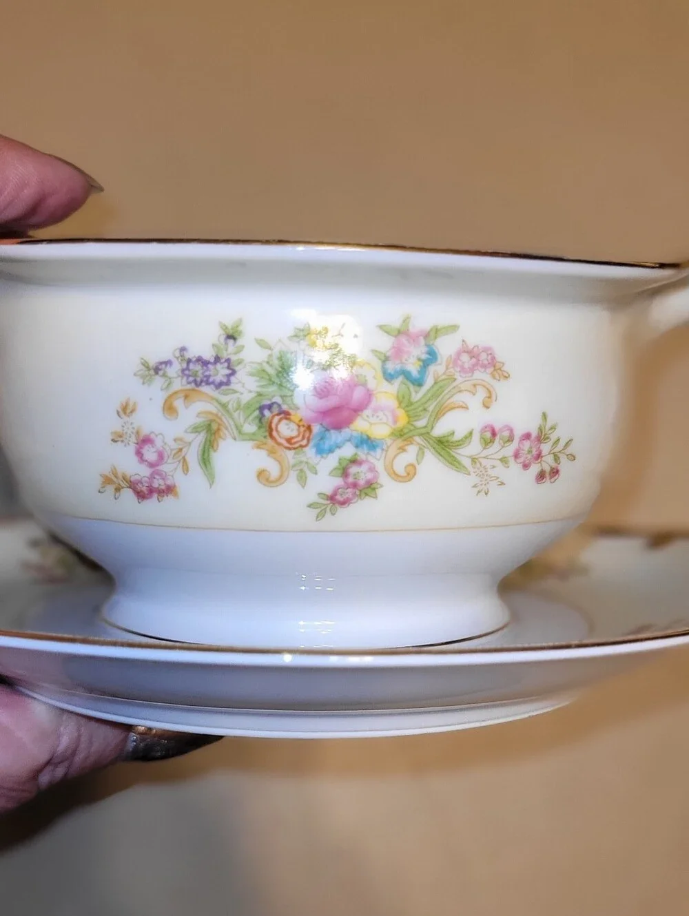 Meito China Hand Painted Porcelain Floral Gravy Boat with Attached Saucer.